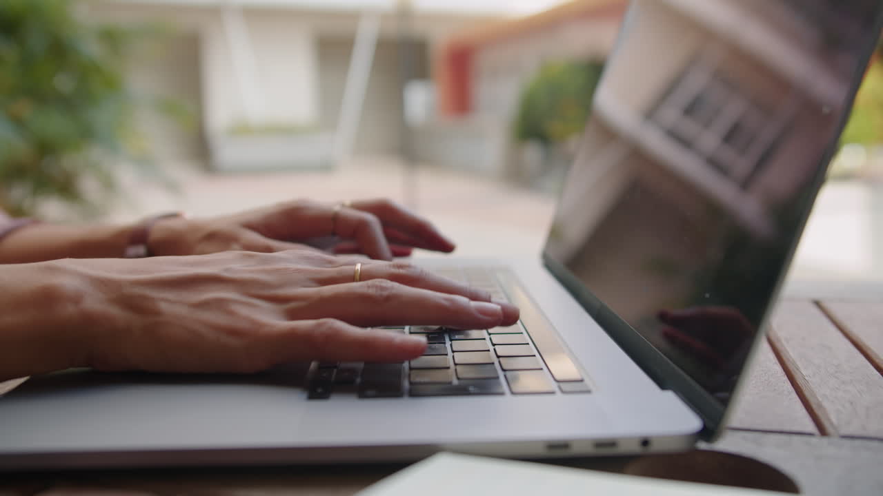 Hands of Woman Writing Email on Laptop