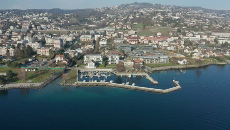 aerial of beautiful small harbor in pully, switzerland