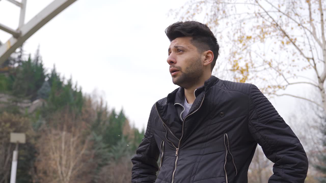 The sad man outdoors in autumn.