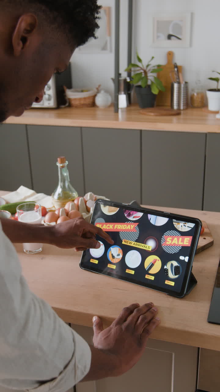 Online shopping on a tablet in the kitchen