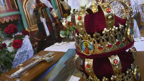 church attributes for wedding ceremony. gold crowns are on the altar. attributes of priest. interior of church