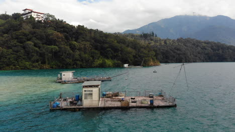 A-drone-shot-of-fisherman-boats-at-Sun-Moon-Lake,-Taiwan