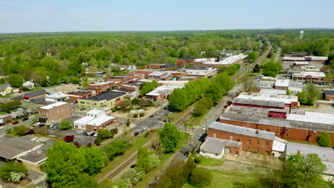 Drone-Orbit-Left-of-Small-Town-USA-Downtown-Mebane-North-Carolina-in-the-summer