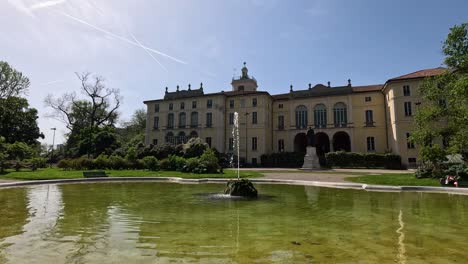 fountain and historic building in milan park