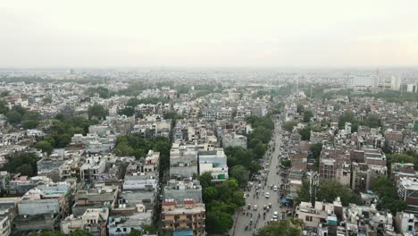 4k aerial shots of new delhi residential suburbs on a beautiful day gliding over rooftops, streets, parks and markets in india