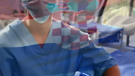 animación de la bandera de croacia sobre el retrato de una cirujana caucásica con máscara quirúrgica en el hospital