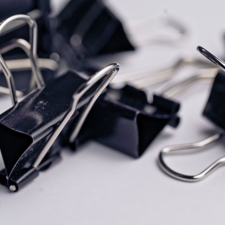 a black clamps on a white background. Subjects for office work and school