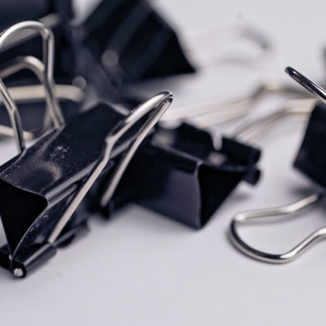 a black clamps on a white background. subjects for office work and school