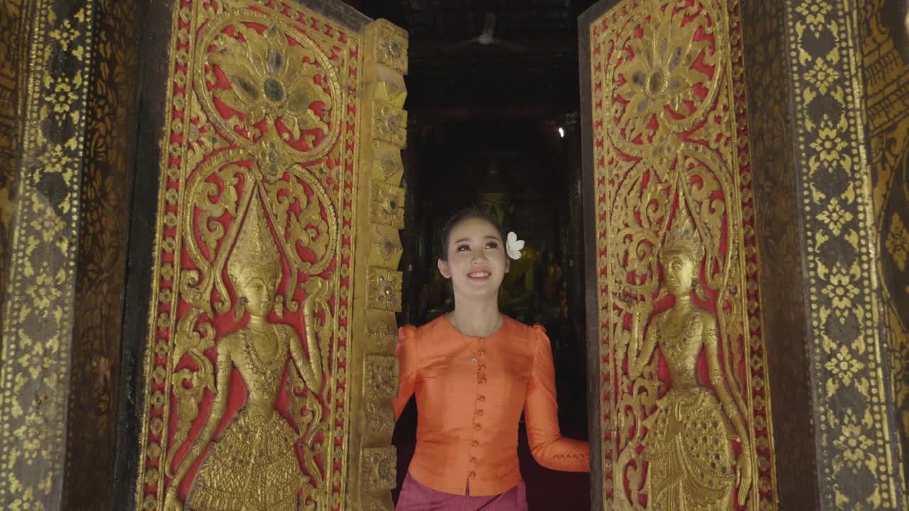 Girl Wearing Lao Traditional Dress Costume Opening Door'S Temple, Slow Motion
