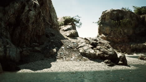 coastal view of a sand beach with cliffs