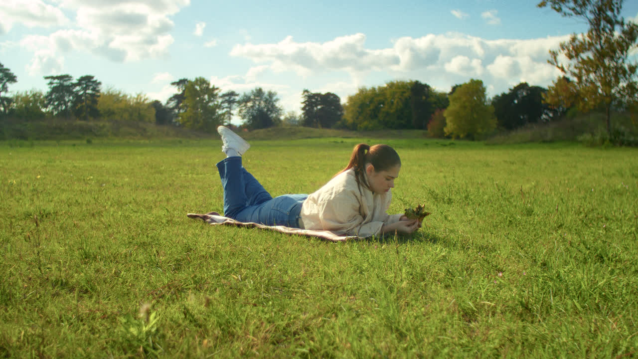Woman relaxing in a park on a sunny day