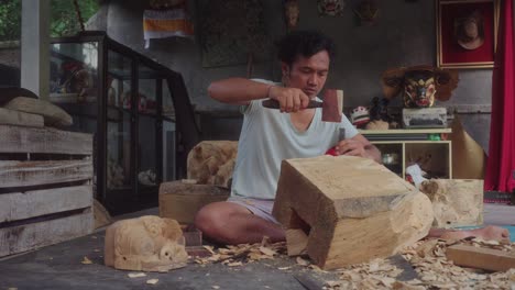 craftsman carving a piece of wood in rustic workshop