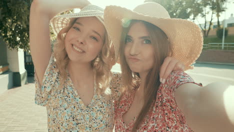 two friends taking a selfie outdoors