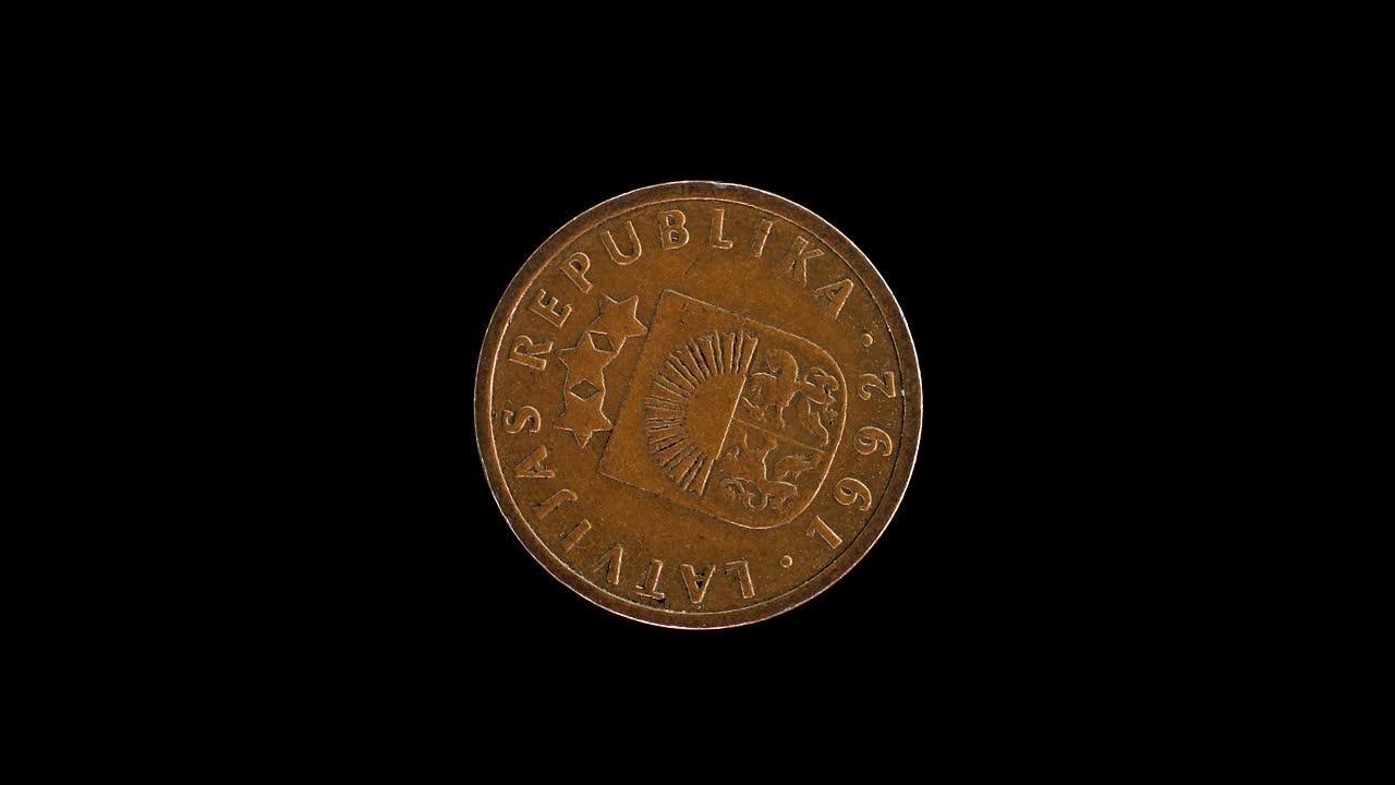 Latvia 1992 1 santims coin obverse featuring small coat of arms rotating on black background