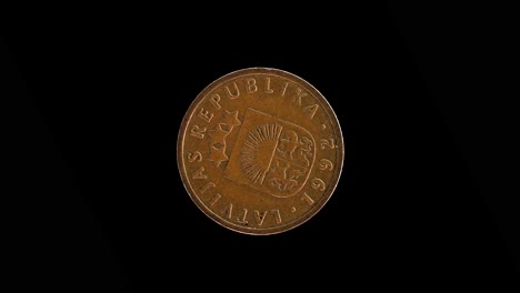 Latvia 1992 1 santims coin obverse featuring small coat of arms rotating on black background