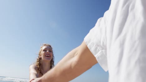 Couple-having-fun-at-beach-on-a-sunny-day-4k