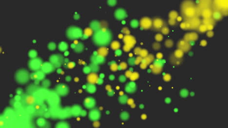 movimiento amarillo y verde brilla con bokeh redondo sobre fondo negro