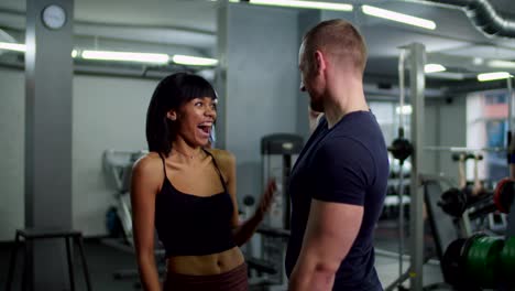 fitness diverse people giving high five at gym