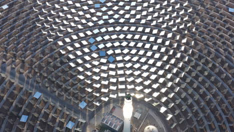 aerial view over a solar power tower with giants mirrors spain gemasolar