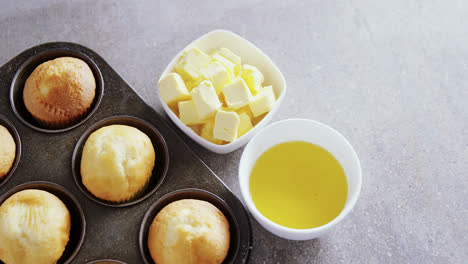 cupcakes and cheese arranged on a concrete background 4k