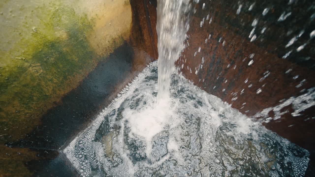 Clear water cascading from a treatment plant, symbolizing purification and renewal. Highlights the importance of water treatment in maintaining clean and sustainable water resources