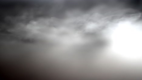 wispy white fog like smoke glides over surface, perfect abstract black background