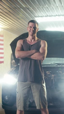 man confidently working on a car in a garage