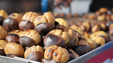 roasted chestnuts on a street vendor's cart