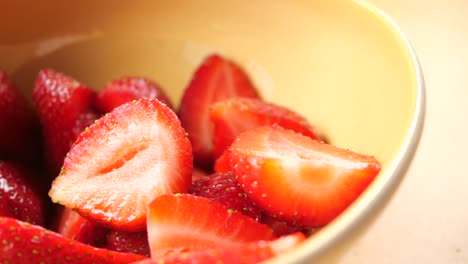 sliced strawberries in a bowl