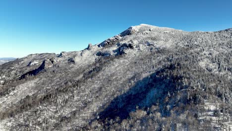 aerial-tilt-up-grandfather-mountain-nc,-north-carolina-in-snow