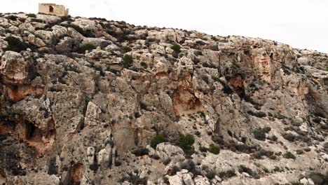 Aerial-drone-video-from-Malta,-Ghar-Lapsi,-flying-towards-the-high-cliffs