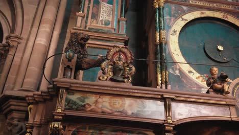 close-up-on-wooden-lion-statue-decoration-detailed-Astronomical-Clock-inside-Notre-Dame-cathedral-Strasbourg