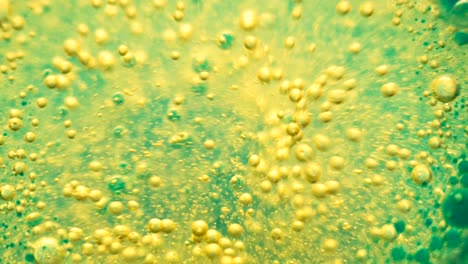 water abstract background. green background. boiling liquid. chemical reaction in a liquid. close-up