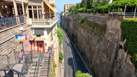 cars driving along a narrow street