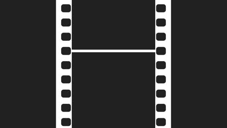 35mm film strip moveing on black background. seamless loopable video footage on solid black screen. abstract film strip design template.