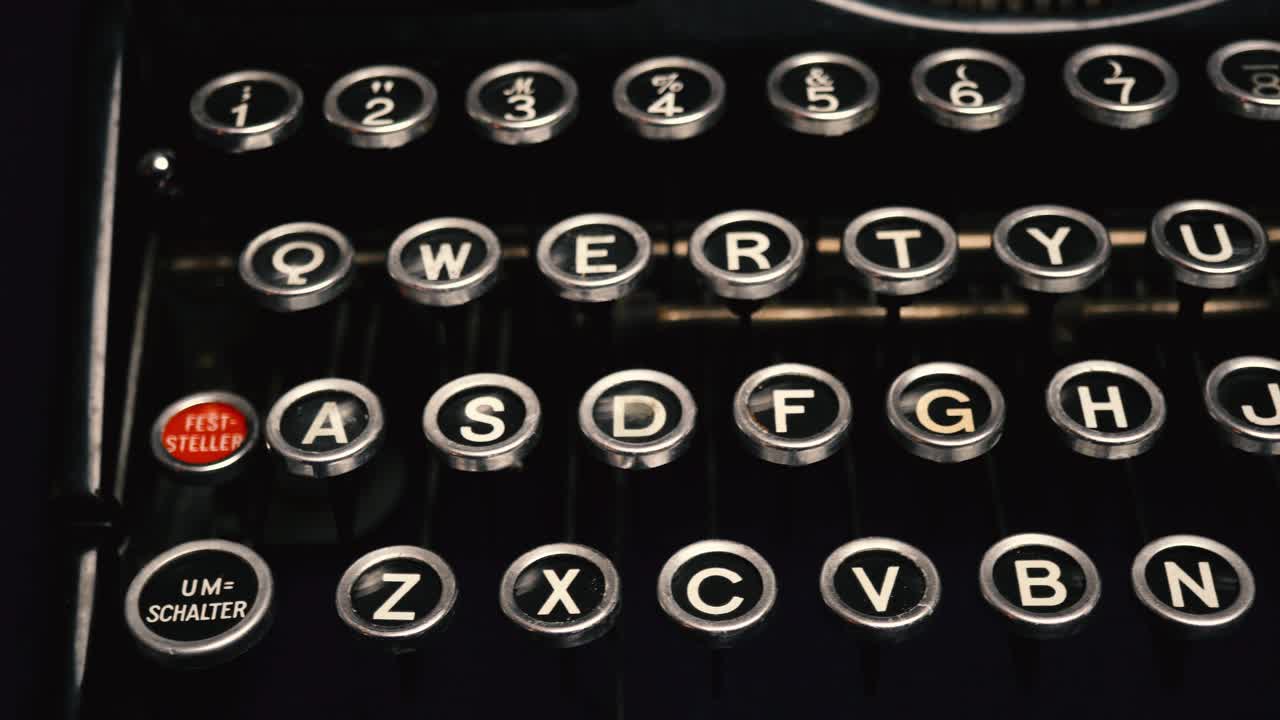 Close up tracking shot along keys of old, vintage manual German typewriter