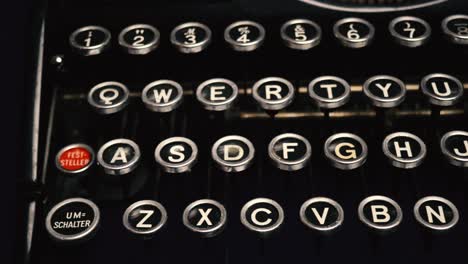 close up tracking shot along keys of old, vintage manual german typewriter