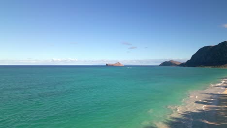 Blue-Ocean-And-Island-In-Distance,-Oahu,-Hawaii---Aerial-Drone-Shot