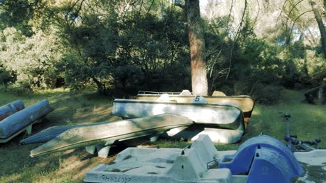 a few pedal boats abandoned near a lake