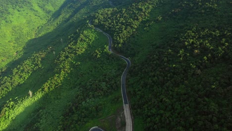 road winding through forested hills