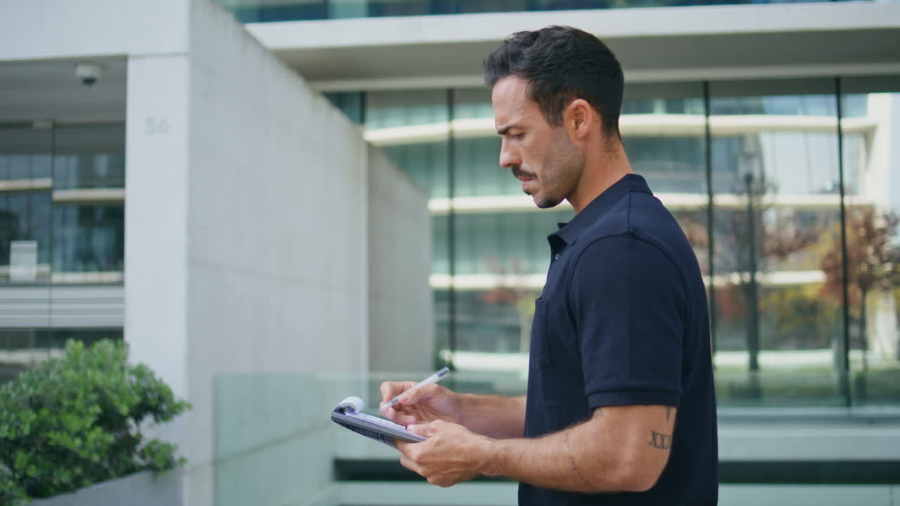 Business man putting sign at architecture place closeup. Employee holding papers