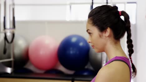 Beautiful-woman-exercising-in-fitness-studio