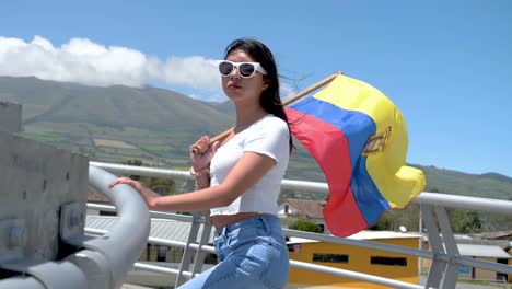 ecuador waving flag hold by latin america young brunette woman outside