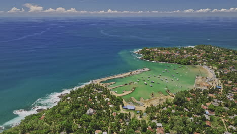 gandara sri lanka aerial v2 birds eye view, flyover coastal village town capturing fishermen harbour, sandy beach, residential neighborhood and indian ocean views - shot with mavic 3 cine - april 2023