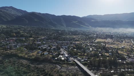 The-town-of-Tafí-del-Valle-in-Tucumán,-Argentina-with-mountains-and-cloudy-sky-in-the-background