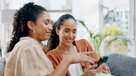 Phone,-lesbian-couple-and-talking-home-sofa-to