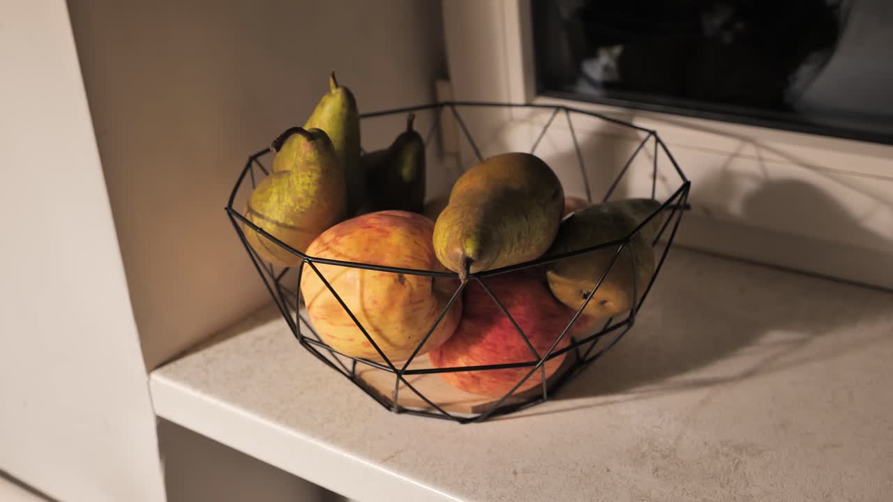 Ripe Pears and Apples in a Geometric Bowl on a Kitchen Windowsill
