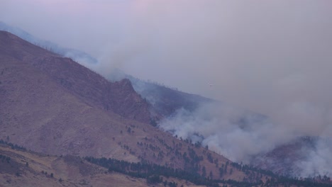 water bomber plane approaching the calwood fire in northern colorado - 10