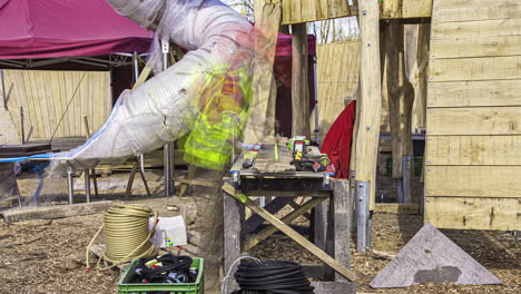 cool time-lapse of construction worker working outside at his workbench in the sunlight