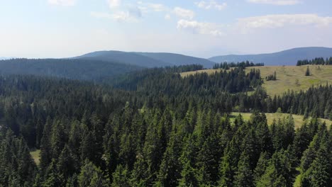 Rogla-Slovenia-resort-forest-grounds-during-the-spring-season-on-sunny-day,-Aerial-flyover-shot